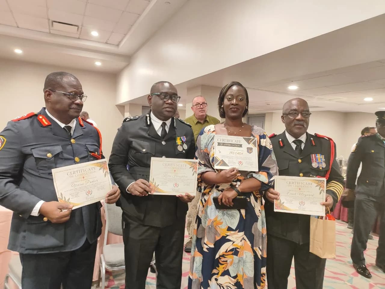 Fire officers and IFECASA leader holding certificates at Puerto Rico 2024