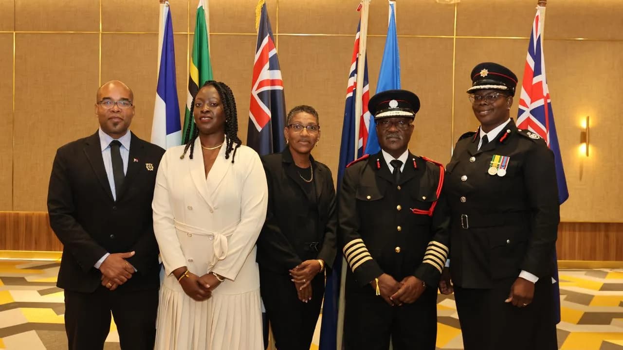 IFECASA leadership group with Caribbean flags at Jamaica 2025